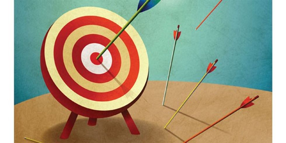 An illustration of an archery target with arrows. One arrow has hit the bullseye, the others have missed.