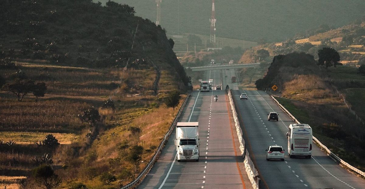 overhaul Truck-on-two-lane-road-with-mountains-in-background--1536x796.jpg